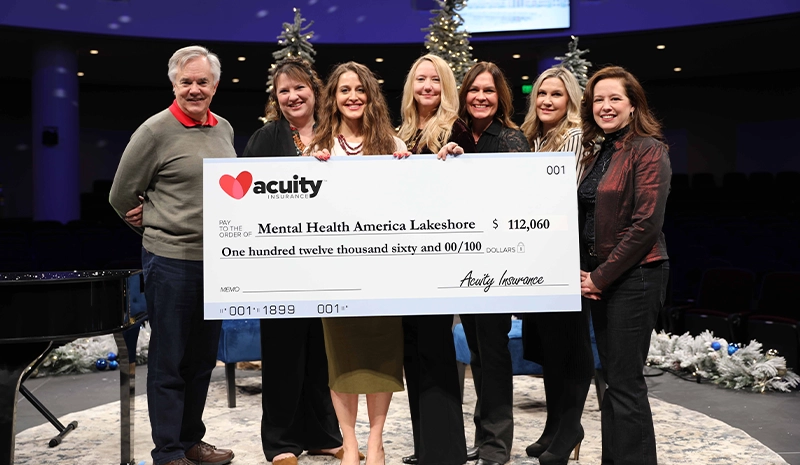 Mental Health America Lakeshore: Dawn Rousse, Dana Bear, Julie Preder, Anna Grunwald, and Andrea Fischer from Mental Health America Lakeshore accept a check for more than $112,000 from Acuity CEO Ben Salzmann and President Melissa Winter.