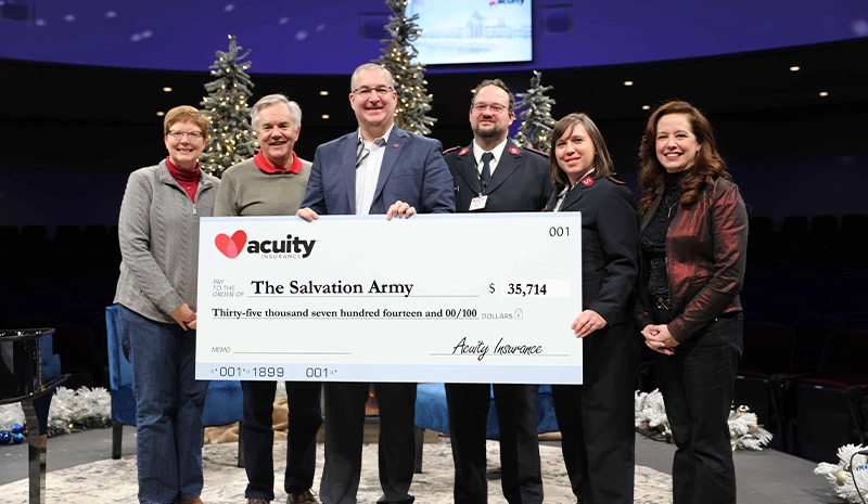 The Salvation Army: Greg Tuck, Lt. Wiley Gladney, and Lt. Heather Gladney of The Salvation Army accept a check for nearly $36,000 from Acuity Vice President - Finance Wendy Schuler, CEO Ben Salzmann, and President Melissa Winter. 