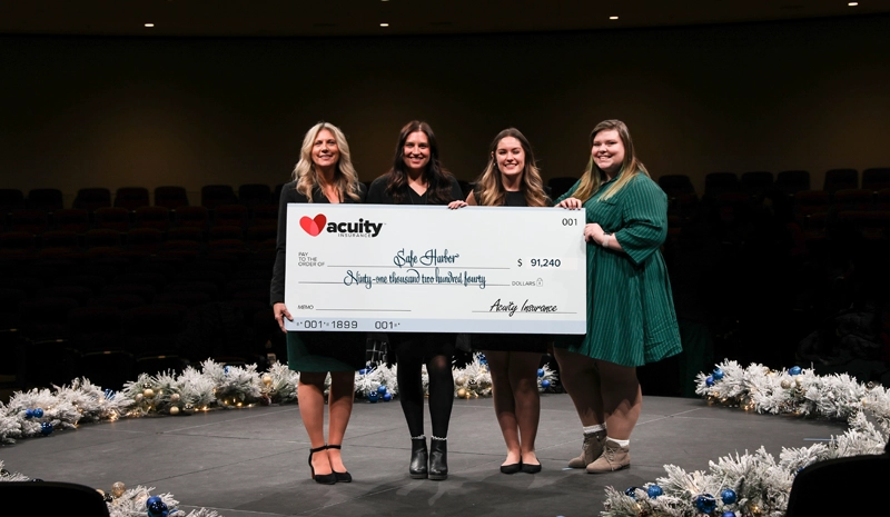 Safe Harbor: Christine Loose, Courtney Stewart, Kelsi Engelhardt, and Galena Jacquart from Safe Harbor accept a check for more than $91,000 from Acuity.