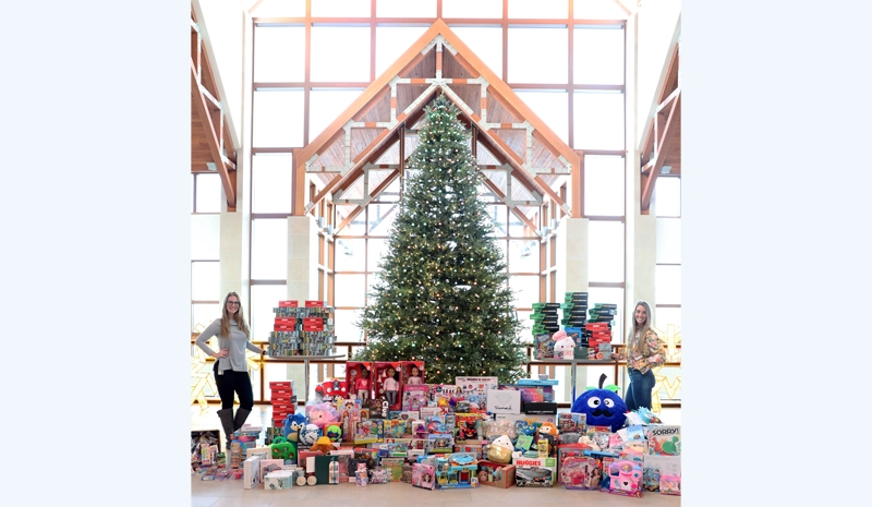 Acuity EAC: Acuity’s Lauren Schultz (left) and Kari Wachter (right) were part of the Employee Activity Committee that organized the company’s holiday gift drive benefitting Sheboygan County Health and Human Services.