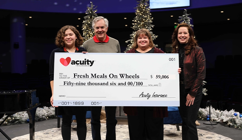 Fresh Meals on Wheels: Allison Laine Thompson and Molly Mata from Fresh Meals on Wheels accept a check for over $59,000 from Acuity CEO Ben Salzmann and President Melissa Winter.