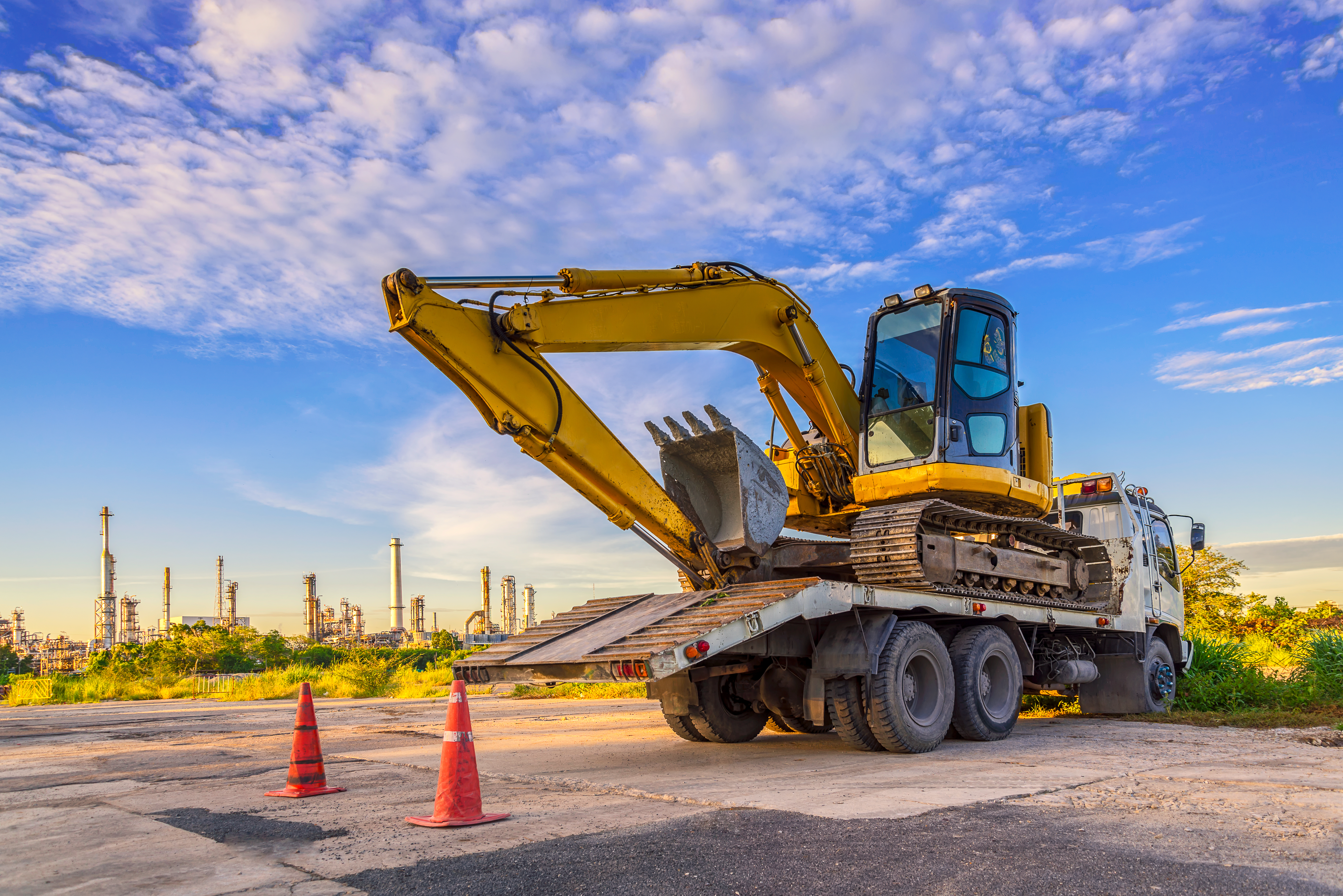 Wheel loader excavator machine  cars park on the truck at the construction site