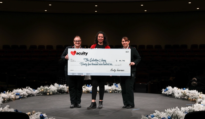 Salvation Army: Major Rochelle McClintock, Carrye Jo Cony, and Lieutenant Heather Gladney from the Salvation Army accept a check for over $44,000 from Acuity.