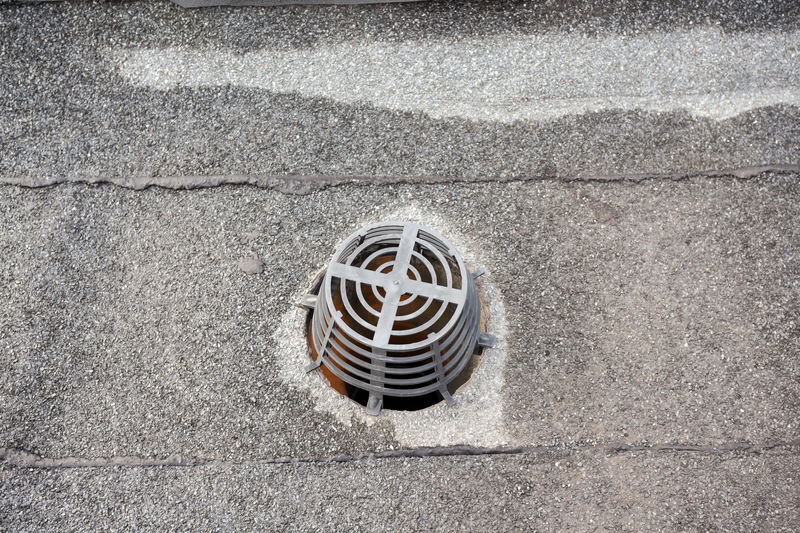 on an flat roof drain is that in order to hold against leaves