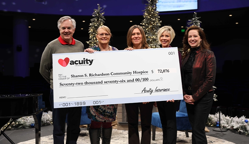 Sharon S. Richardson: Sara Weber, Charmaine Conrad, and Julie Steinert from Sharon S. Richardson Community Hospice accept a check for over $72,000 from Acuity CEO Ben Salzmann and President Melissa Winter.